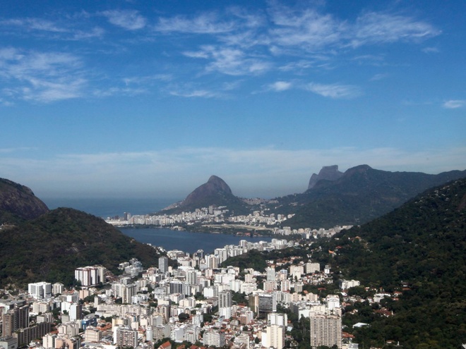 the-city-is-nestled-on-the-mountainous-shores-of-guanabara-bay-on-the-atlantic-ocean-the-entrance-of-the-bay-is-guarded-by-the-iconic-sugarloaf-mountain-1470654414 660x0